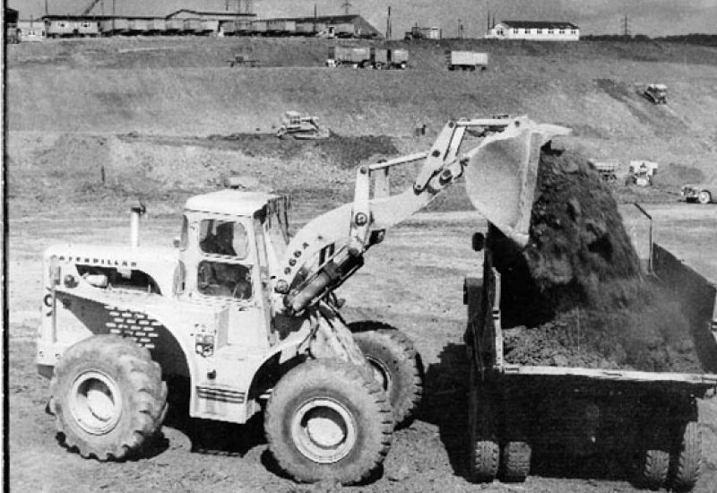 Veit's History - Bulldozer Loading Dirt To Truck In 1960s