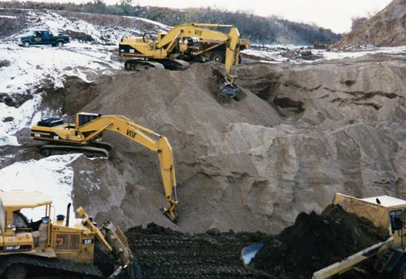Veit's History - Heavy Equipment Digging Dirt