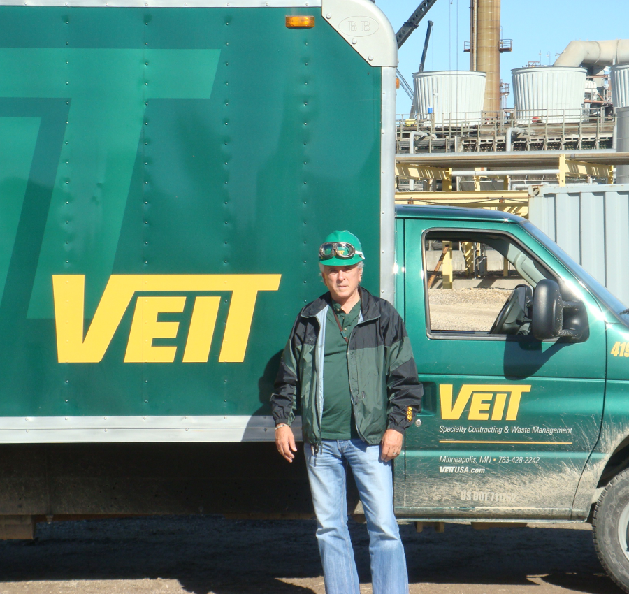 Vaughn Veit Standing In Front Veit's Truck