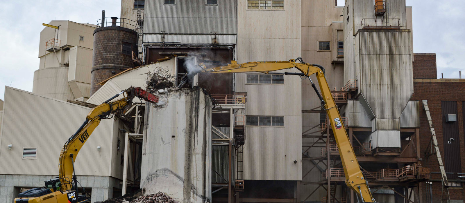 Two Excavators in Action at The Silve Lake Site Demolition