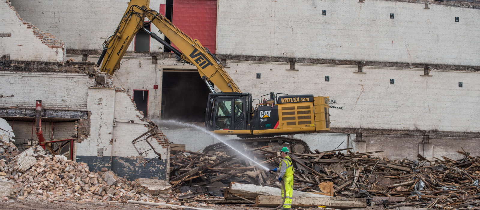 Our Crew On Excavator Destroying Water Street Building