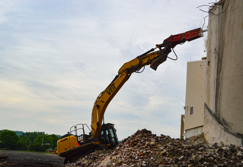 Excavator Lifting Rocks For Hopkins Cold Storage Project