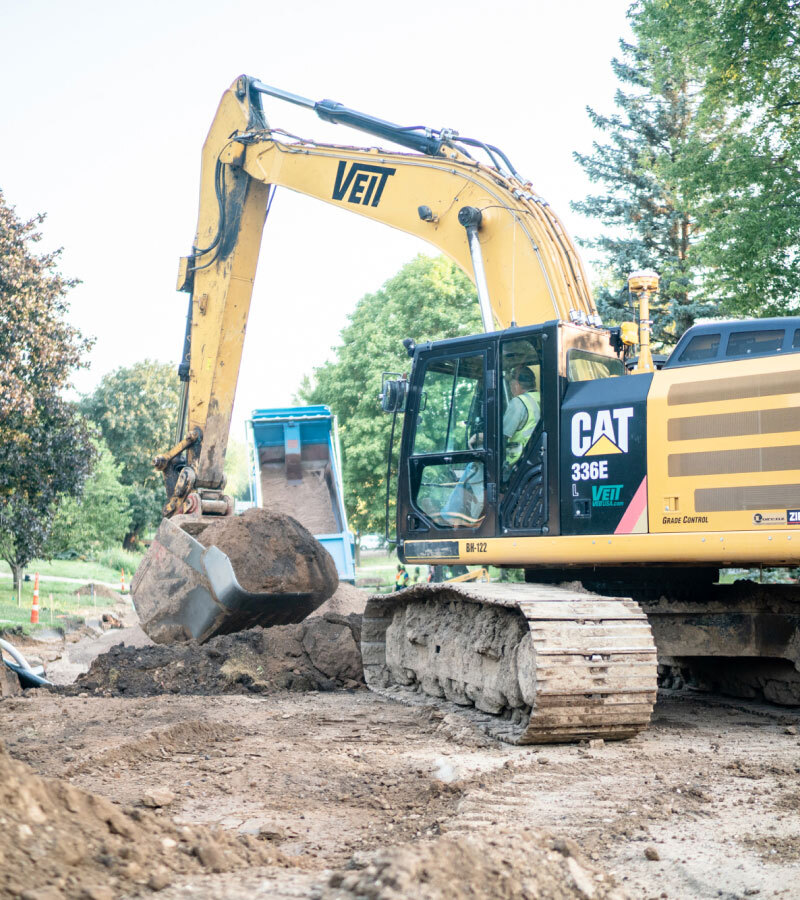 Veit's Medium Size Excavator Lifting Dirt Soil