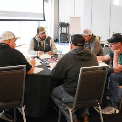 Multiple people sitting around the table