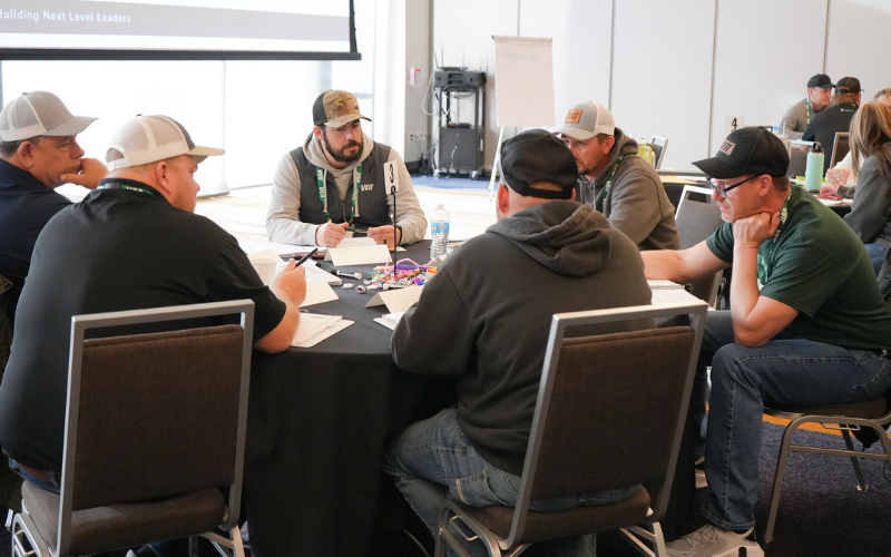 Multiple people sitting around the table