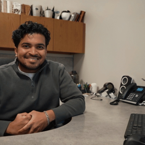 Project Manager Smiling at His Desk