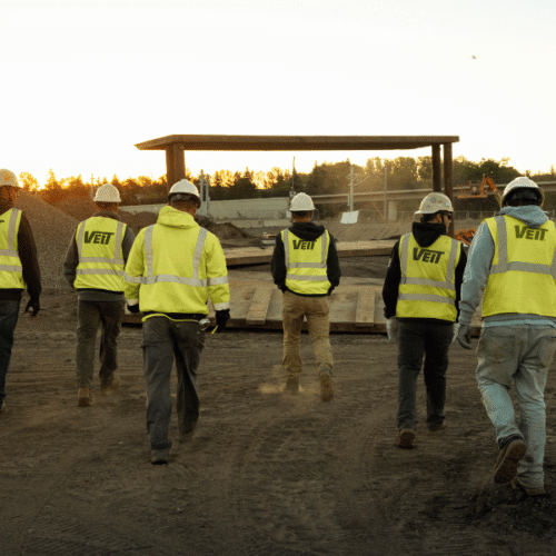 Jobsite crew walking in the early morning