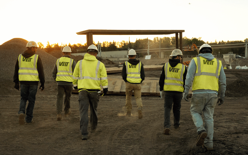 Jobsite crew walking in the early morning