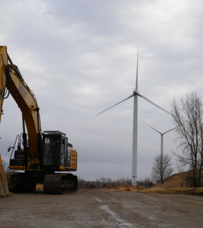 Veit Equipment in front of Willmar Turbines