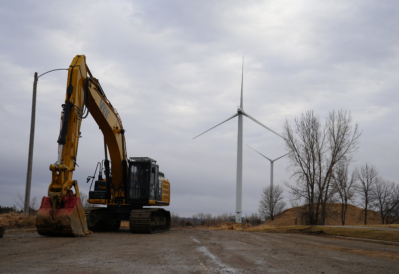 Veit Equipment in front of Willmar Turbines