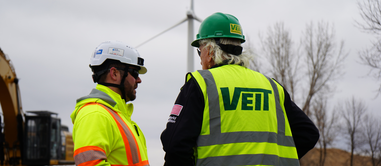 Two men talking on Willmar project job site