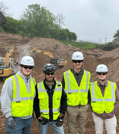 Interns smiling at a jobsite visit