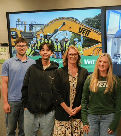 Interns smiling with leader of Human Resources